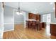 Open-concept kitchen layout with an island, breakfast bar and seamless flow at 4005 Olde Waverly Way, Fuquay Varina, NC 27526