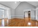 Spacious living room with vaulted ceilings, hardwood floors, and natural light at 4005 Olde Waverly Way, Fuquay Varina, NC 27526