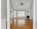 Spacious living room with vaulted ceilings, hardwood floors, and a cozy fireplace at 4005 Olde Waverly Way, Fuquay Varina, NC 27526