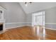 Spacious living room with vaulted ceilings, hardwood floors, and a cozy fireplace at 4005 Olde Waverly Way, Fuquay Varina, NC 27526