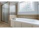 Elegant bathroom with separate shower and soaking tub at 4005 Olde Waverly Way, Fuquay Varina, NC 27526