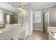 Main bathroom with double vanity, soaking tub, and tiled shower at 4005 Olde Waverly Way, Fuquay Varina, NC 27526