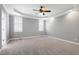 Spacious main bedroom with tray ceiling, ceiling fan, and plantation shutters at 4005 Olde Waverly Way, Fuquay Varina, NC 27526
