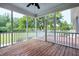 Inviting screened porch with wood flooring and backyard views at 4005 Olde Waverly Way, Fuquay Varina, NC 27526