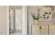 Bright bathroom featuring a glass shower, a cabinet, and a decorative plant and painting at 405 Commons Walk Cir, Cary, NC 27519