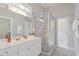 Bright bathroom features a glass shower, white cabinets, and modern fixtures at 405 Commons Walk Cir, Cary, NC 27519