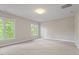 Bedroom with carpet floors and dual windows at 405 Commons Walk Cir, Cary, NC 27519
