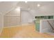 Bright and open bonus room featuring hardwood floors and custom built-ins at 405 Commons Walk Cir, Cary, NC 27519