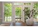 Bright and airy dining room featuring a table, chairs, and large windows at 405 Commons Walk Cir, Cary, NC 27519