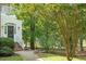 Inviting front entrance with manicured landscaping and charming sidelights at 405 Commons Walk Cir, Cary, NC 27519
