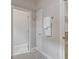 Hallway with views to a bathroom and closet and a set of towels hanging on the wall at 405 Commons Walk Cir, Cary, NC 27519