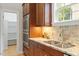 Granite counters compliment stainless steel appliances and wood cabinets at 405 Commons Walk Cir, Cary, NC 27519