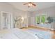 Bright main bedroom with wood floors, stylish decor, and ample space at 405 Commons Walk Cir, Cary, NC 27519