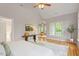 Spacious main bedroom with vaulted ceilings, hardwood floors, and a comfortable seating area at 405 Commons Walk Cir, Cary, NC 27519