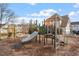 Community playground with slides and climbing structures for outdoor activity and enjoyment at 405 Commons Walk Cir, Cary, NC 27519