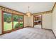 Dining room with large windows and view of greenery at 462 Sullivan Rd, Selma, NC 27576
