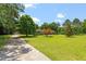Lovely home with a long driveway and beautiful trees creating a park-like setting at 462 Sullivan Rd, Selma, NC 27576