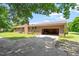 Brick home with an attached two-car garage and spacious driveway at 462 Sullivan Rd, Selma, NC 27576