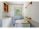 Laundry room with utility sink and washer/dryer at 462 Sullivan Rd, Selma, NC 27576