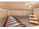 Unfinished basement featuring concrete floors, open ceiling, and ladder for ease of access to the attic at 500 N Duke St # 55-105, Durham, NC 27701