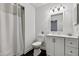 Modern bathroom with black tile floors, sleek white vanity, and shower featuring contemporary fixtures at 500 N Duke St # 55-105, Durham, NC 27701