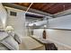 Comfortable bedroom featuring a cozy bed, carpeted floors, and lofted design with exposed wood ceiling at 500 N Duke St # 55-105, Durham, NC 27701