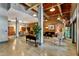 Open common area with exposed brick, polished concrete, a pool table, and modern and vintage decor at 500 N Duke St # 55-105, Durham, NC 27701