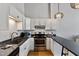 Well-equipped kitchen featuring granite countertops, stainless steel appliances, and ample cabinet space at 500 N Duke St # 55-105, Durham, NC 27701