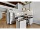 Modern kitchen with stainless steel appliances, black granite countertops, and pendant lighting at 500 N Duke St # 55-105, Durham, NC 27701