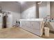 Clean laundry room featuring new washing machines and dryers, plus updated water heating system at 500 N Duke St # 55-105, Durham, NC 27701