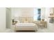 Bright bedroom featuring a well-styled bed, complemented by a desk, chair, and neutral-toned decor at 540 Morning Light Dr, Angier, NC 27501