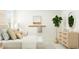 Bright bedroom featuring a well-styled bed, complemented by a dresser, mirror, and neutral-toned decor at 540 Morning Light Dr, Angier, NC 27501