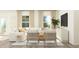 Bright living room featuring white furniture, modern decor, and ample natural light at 540 Morning Light Dr, Angier, NC 27501