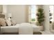 Bright bedroom features a neutral palette, large window, and a decorative green plant at 544 Morning Light Dr, Angier, NC 27501