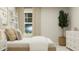 Bedroom featuring a large bed with decorative pillows and a white dresser at 544 Morning Light Dr, Angier, NC 27501