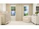 Bedroom featuring a crib, cushioned chair, and a dresser at 544 Morning Light Dr, Angier, NC 27501