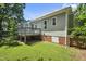 The backyard features a well-maintained lawn and a charming deck, perfect for outdoor entertaining and relaxation at 6 Danesfield Ct, Durham, NC 27707