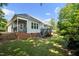 The home has a large deck, a landscaped yard, and mature trees, creating a private outdoor oasis at 6 Danesfield Ct, Durham, NC 27707