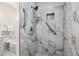 Elegant marble bathroom with a large shower and modern fixtures at 6 Danesfield Ct, Durham, NC 27707