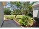 Well-manicured front yard with lush landscaping and mature trees surrounding the property at 6 Danesfield Ct, Durham, NC 27707