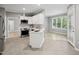 Bright kitchen features white cabinets, stainless appliances, and an open layout at 6 Danesfield Ct, Durham, NC 27707