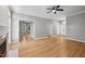 Spacious living room features hardwood floors, a fireplace, and an open layout to the foyer and other rooms at 6 Danesfield Ct, Durham, NC 27707
