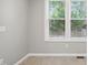 Room showcasing tiled floors, neutral walls, and window providing a bright view at 6 Danesfield Ct, Durham, NC 27707