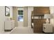 Shared bedroom with bunk beds, modern lighting, natural light, and ample storage at 604 Vega Bluff Ln, Angier, NC 27501