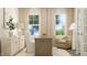 Inviting home office with neutral tones, comfortable seating, and ample natural light at 604 Vega Bluff Ln, Angier, NC 27501