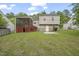 Home exterior featuring a screened porch, well-maintained lawn, and mature trees at 6927 Beaverwood Dr Dr, Raleigh, NC 27616