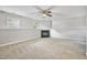 Finished basement boasts a cozy fireplace and neutral carpet at 6927 Beaverwood Dr Dr, Raleigh, NC 27616