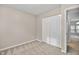 Bedroom with plush carpet and a large closet at 6927 Beaverwood Dr Dr, Raleigh, NC 27616