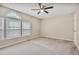Bedroom with a ceiling fan, a window, and plush carpet at 6927 Beaverwood Dr Dr, Raleigh, NC 27616