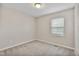 Inviting bedroom featuring a window, carpeted floor, and neutral paint at 6927 Beaverwood Dr Dr, Raleigh, NC 27616
